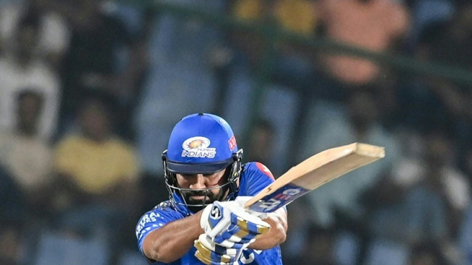 Mumbai win first IPL game in tense chase after Rohit's 65