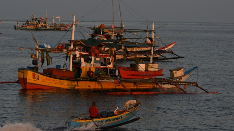 Philippines vows removal of Chinese barriers at disputed reef 