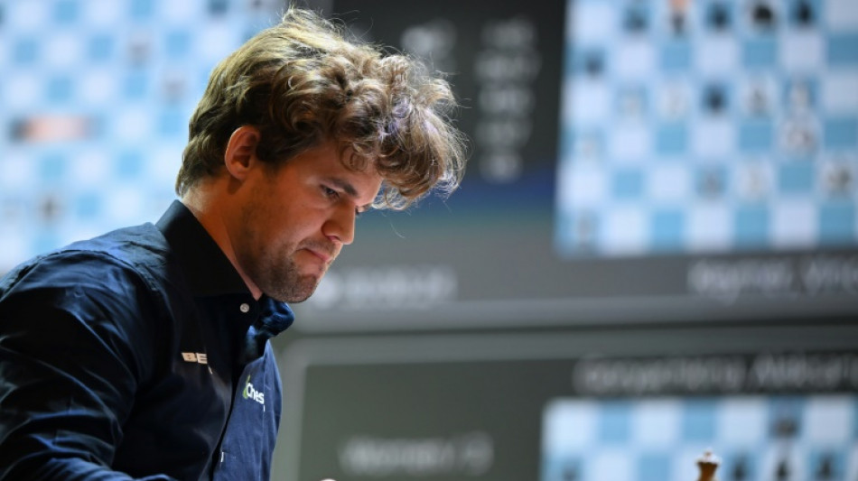 Chess great Carlsen held to draw by 143,000 players