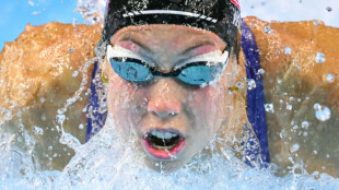 Walsh defies illness in US camp to win butterfly world gold