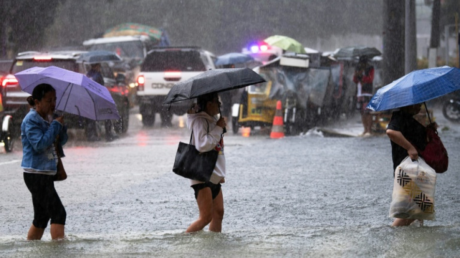 Philippines flooding displaces thousands, two missing