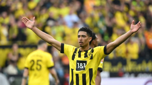 Bellingham brace helps six-goal Dortmund keep pace with Bayern