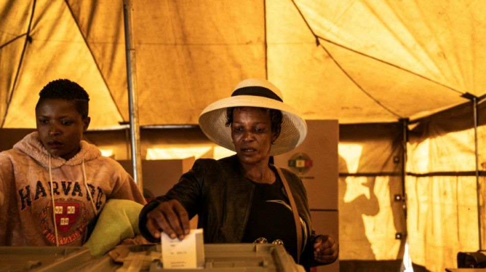 Zimbabweans vote in tense poll as president seeks new term