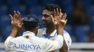 West Indies grind through turgid day against India