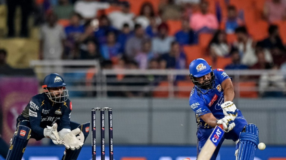 Rohit stars as Mumbai knock Gujarat out of IPL