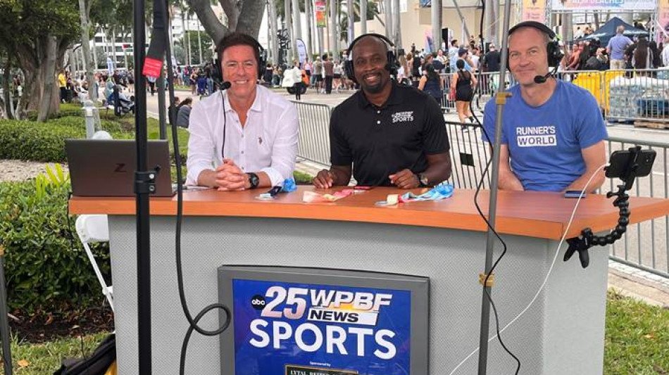 A group of men sitting at a tableAI-generated content may be incorrect.