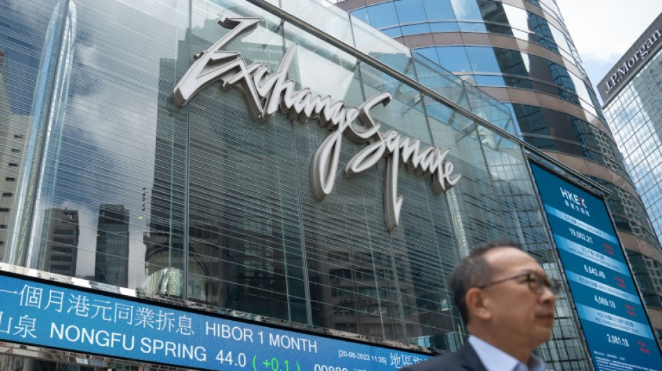 Asian stocks drop after Fed warning, oil dips with Mideast in focus