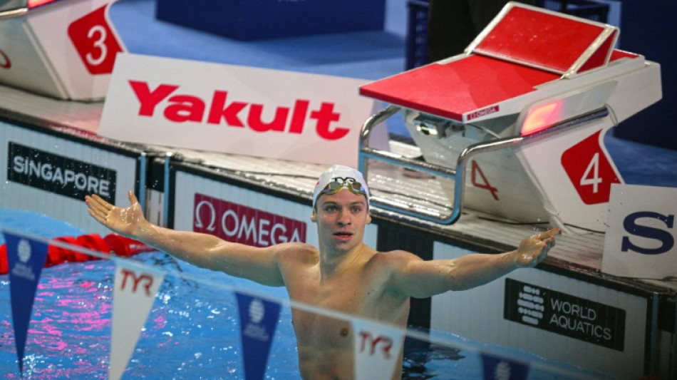 'Can't believe it': Marchand shatters long-standing world record