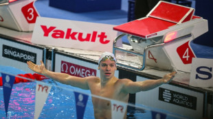 Marchand shatters record as US, Australia win more world gold