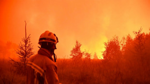 Belgium fire halts short of German border, but not 'contained' 