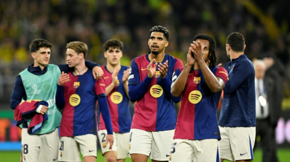 Barca suffer morale blow in Dortmund amid quadruple hunt